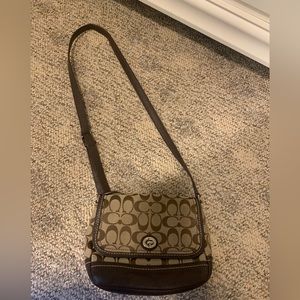 Traditional pattern coach crossbody